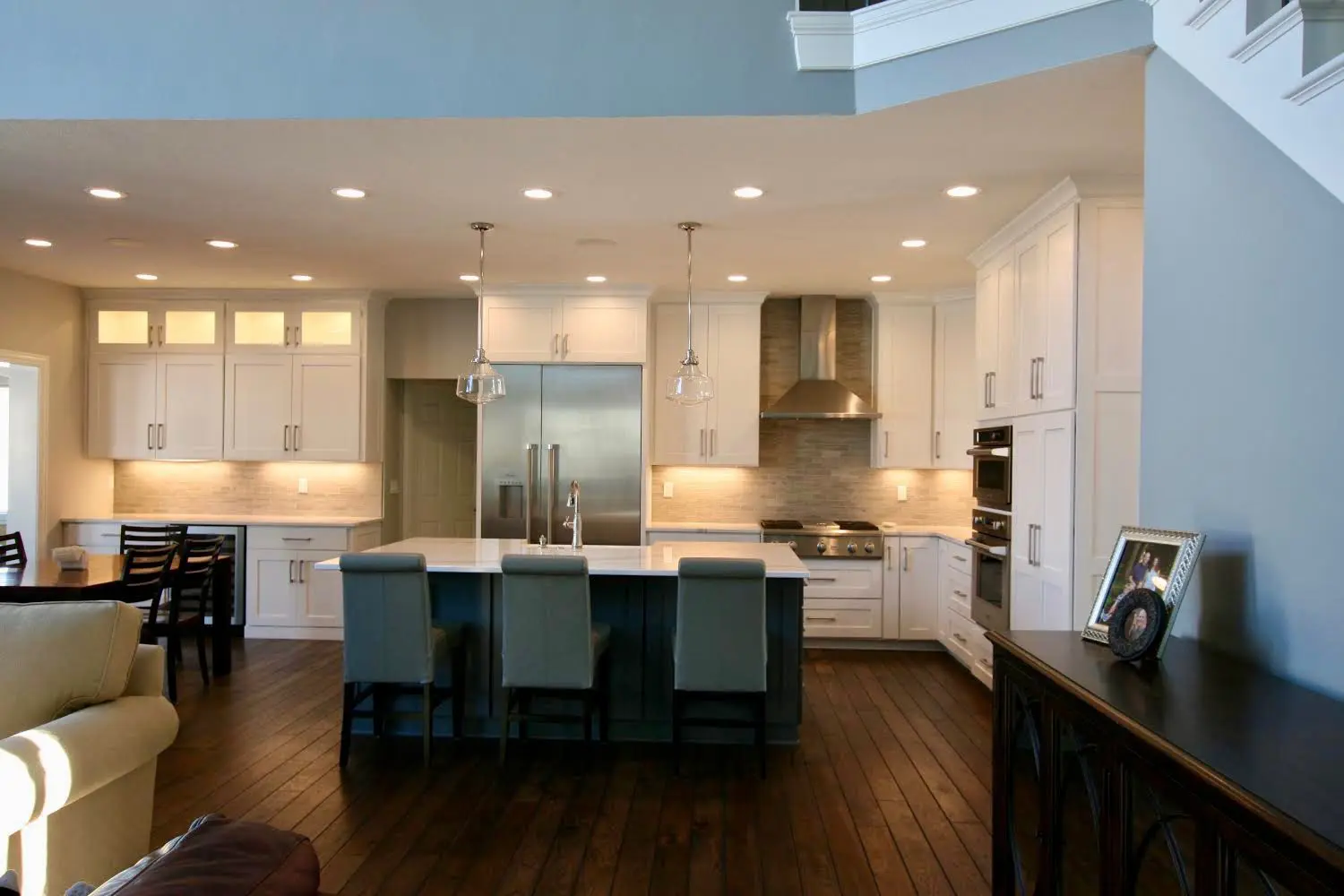 White kitchen remodelling with dark flooring