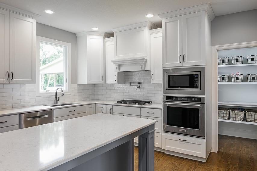 A beautiful kitchen white cabinets