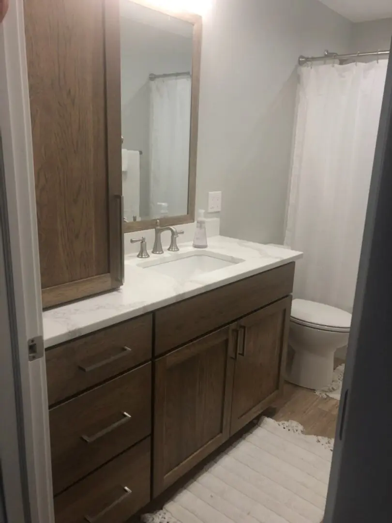 Custom bathroom renovation with curio cabinets