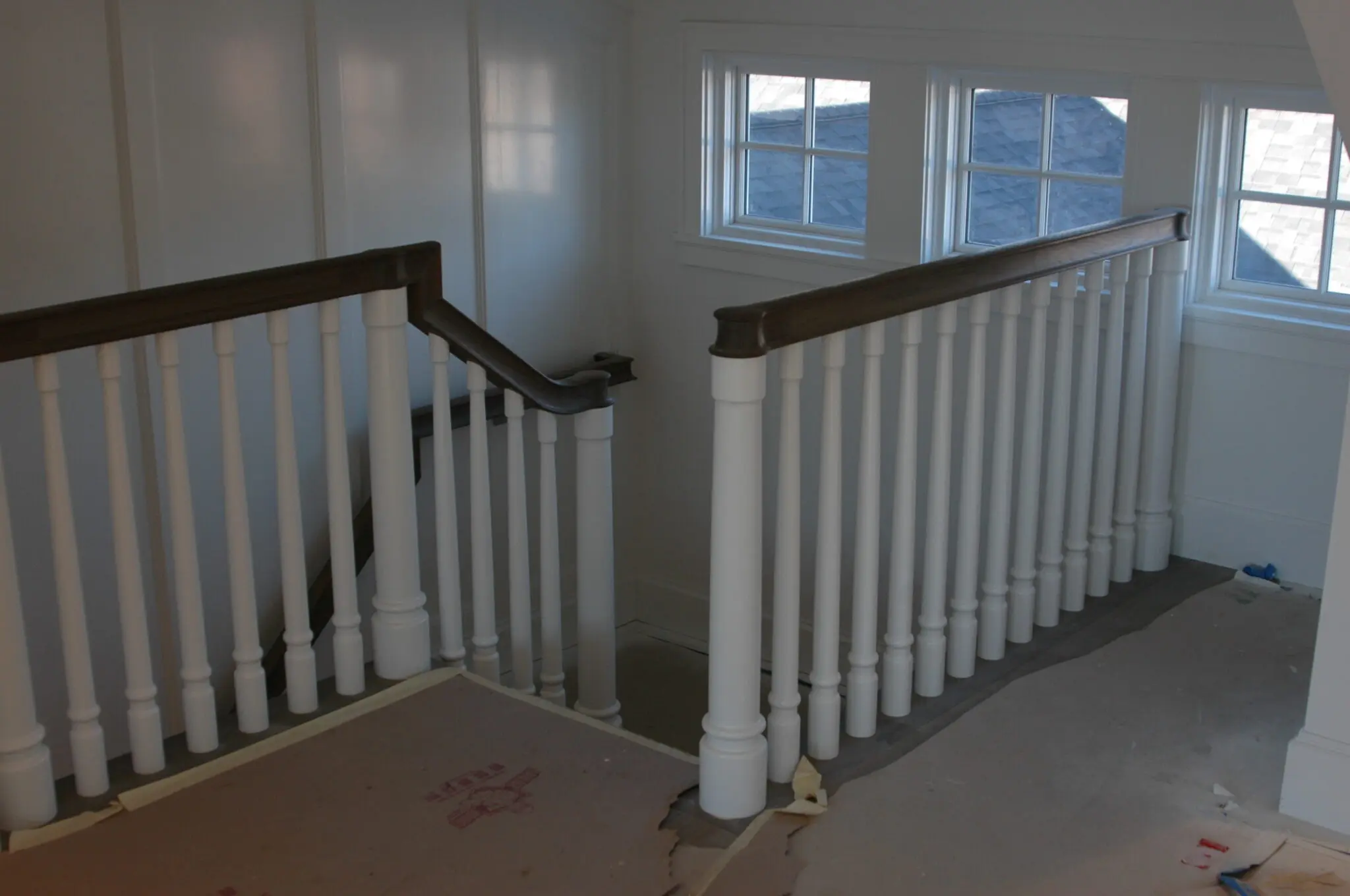Traditional railing interior design with painted stairs