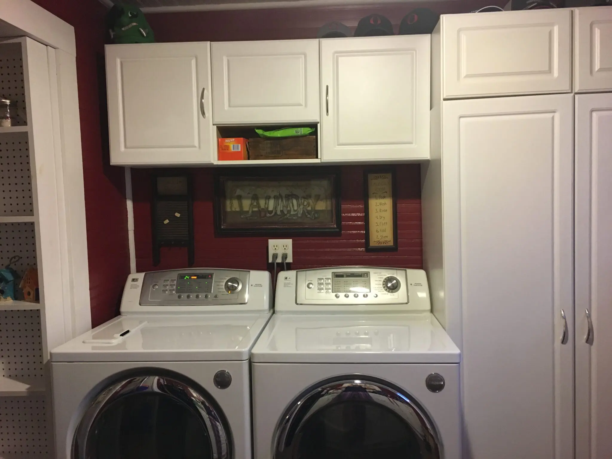 The laundry room with stacked washing machine and dryer