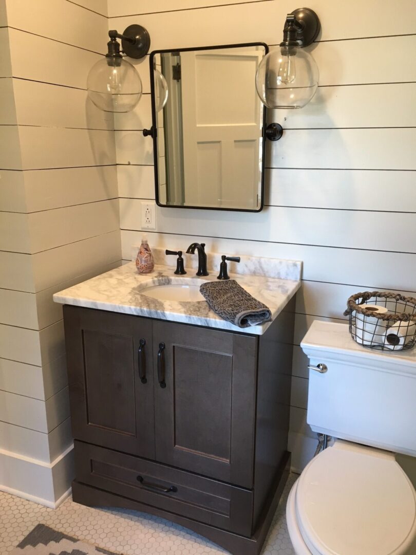 The custom vanity bathroom with rustic storage shelves